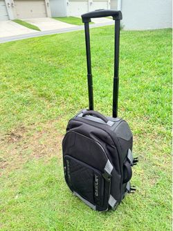 Oakley carry-on luggage for sale, measuring 24 x 9.5 x 14.5 inches. /
