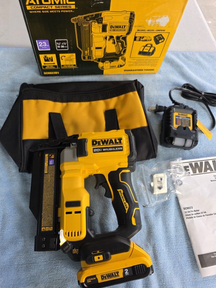 In LIKE NEW CONDITION DEWALT 20V BRUSHLESS CORDLESS 23 GAUGE PIN NAILER KIT. $175