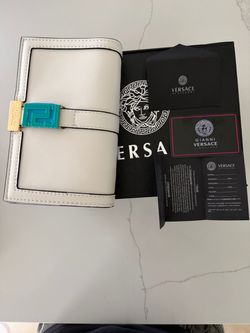 white and gold Versace purse