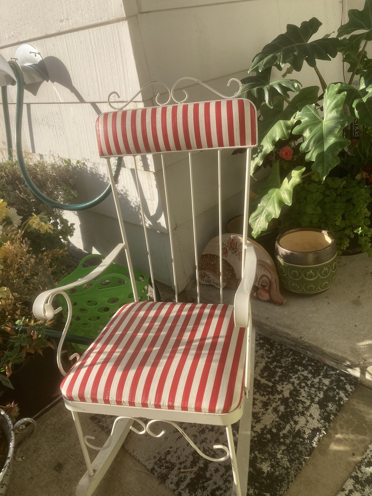 Childs 1950’s White metal rocking chair with red and white striped cushions.