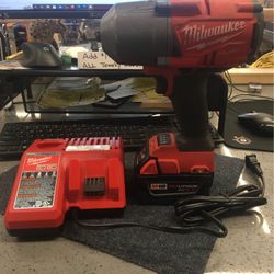 Milwaukee Impact drill with charger and battery