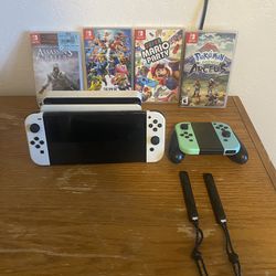 Nintendo Switch OLED with 2 Controllers and Games