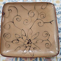 Never used plate, microwavable and washable - brown color.