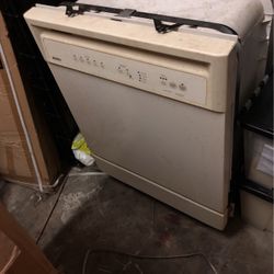Used beige colored Kenmore dishwasher model 665