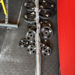 Commercial urethane Olympic weights 280lbs total plus 7ft 45lbs bar