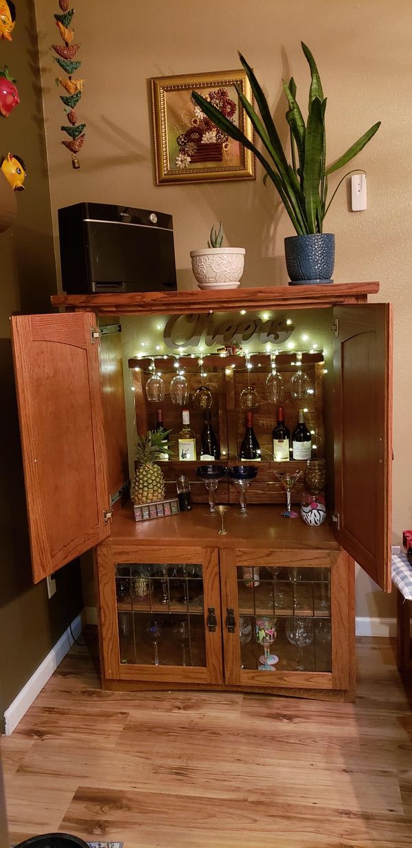 Convert your old entertainment center into a wine or liquor