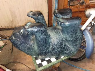 Bear table with oval glass top