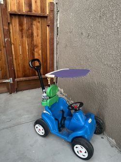 Kids push around buggy