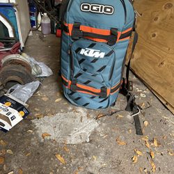 KTM racing ogio rolling tote with two pairs of pants and boots not sure size hundred bucks takes off