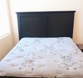 Full size bed set with pillow top mattress, box spring, black headboard, mattress cover and metal box spring frame with wheels.