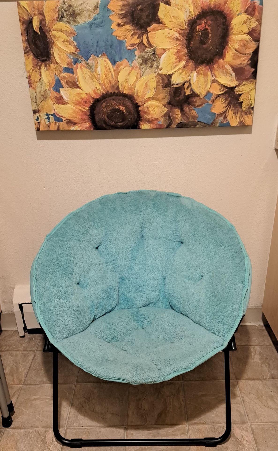 Cute blue saucer chair.