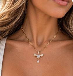 Brand new Gold-Tone Crystal Winged Heart Pendant Necklace ✨