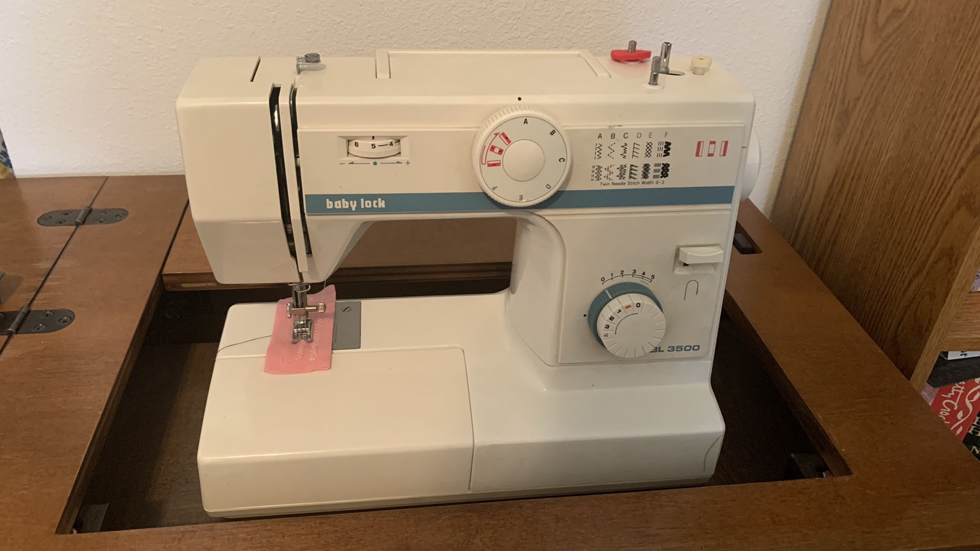 Baby Lock Sewing Machine in Foldout Cabinet