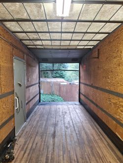 Large enclosed cargo trailer 24 ft x 8 and 1/2 ft 9 ft tall inside area