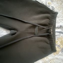 Essentials sweatpants color is like a green black size is S comes with bag and it like new only worn a couple times