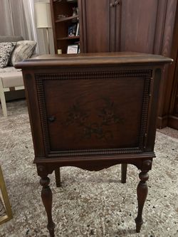 Small antique table, minor imperfections on top.