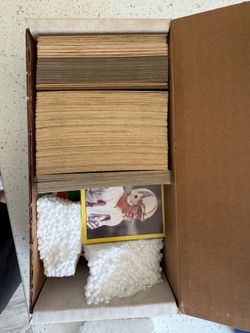 Box with baseball football and hockey sports cards pick up in Orting