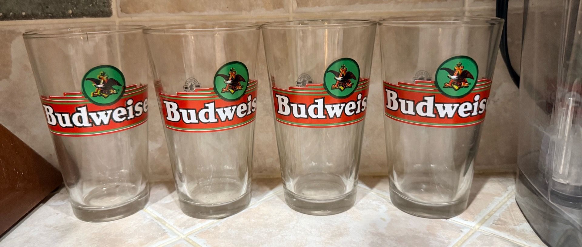 vintage Budweiser 16oz pint glasses featuring the iconic red and green Anheuser-Busch eagle logo