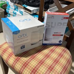 Orbi Tri Band Mesh WiFi 6 System And Surfboard S33 Router