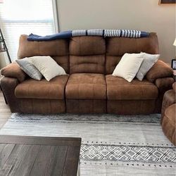 Reclining Sectional Couch, recliner and Farmhouse Coffee Table with sliding doors.