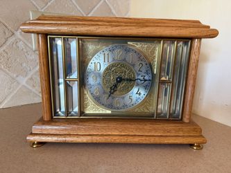 Vintage Wood Mantle Clock by Ansonia Gold Medallion Mantle Clock Solid oak Beveled glass side panels Movement is typically German made battery operate