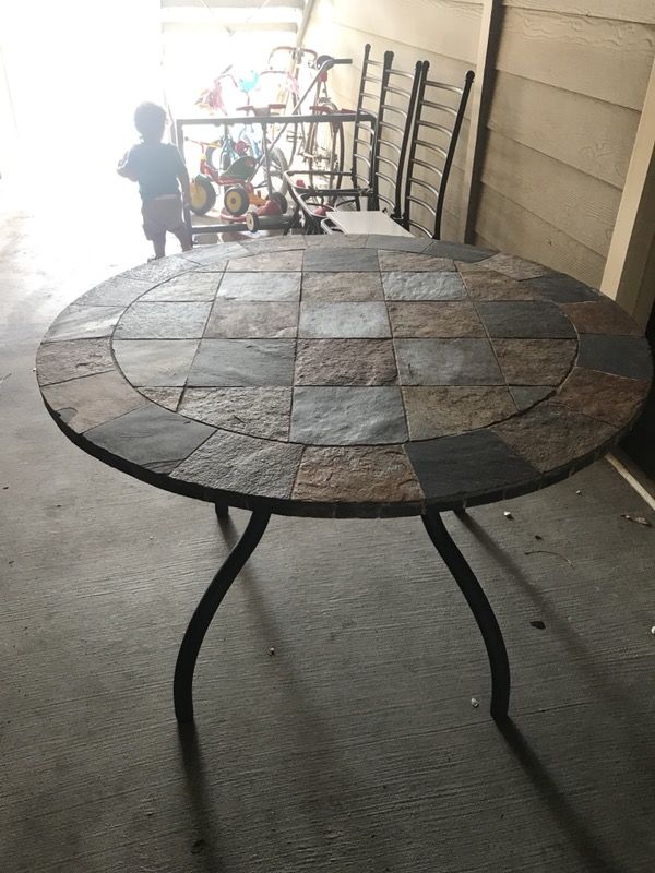 Antigo round fixed slate table by Ashley Furniture
