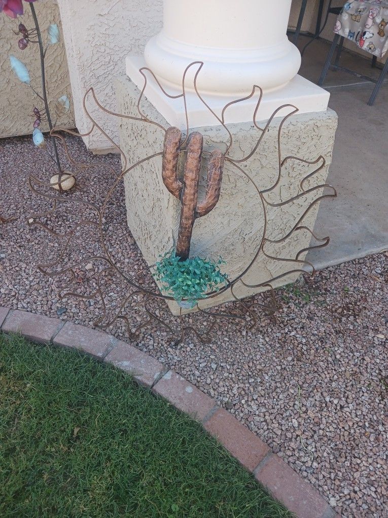 Metal Son With Potted Plant Inside
