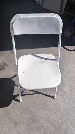 White plastic folding chair