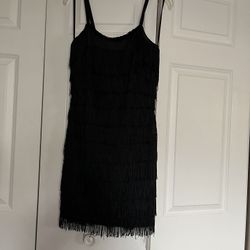 It’s Very Cute Short Cocktail Dress The Size Is Six. The Color Is Black. It’s All Tassel.Dress 