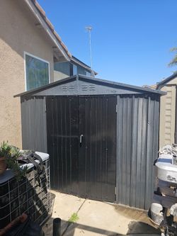 Metal  shed I believe is 10ft X 8ft already take part ready to go only 2 years old