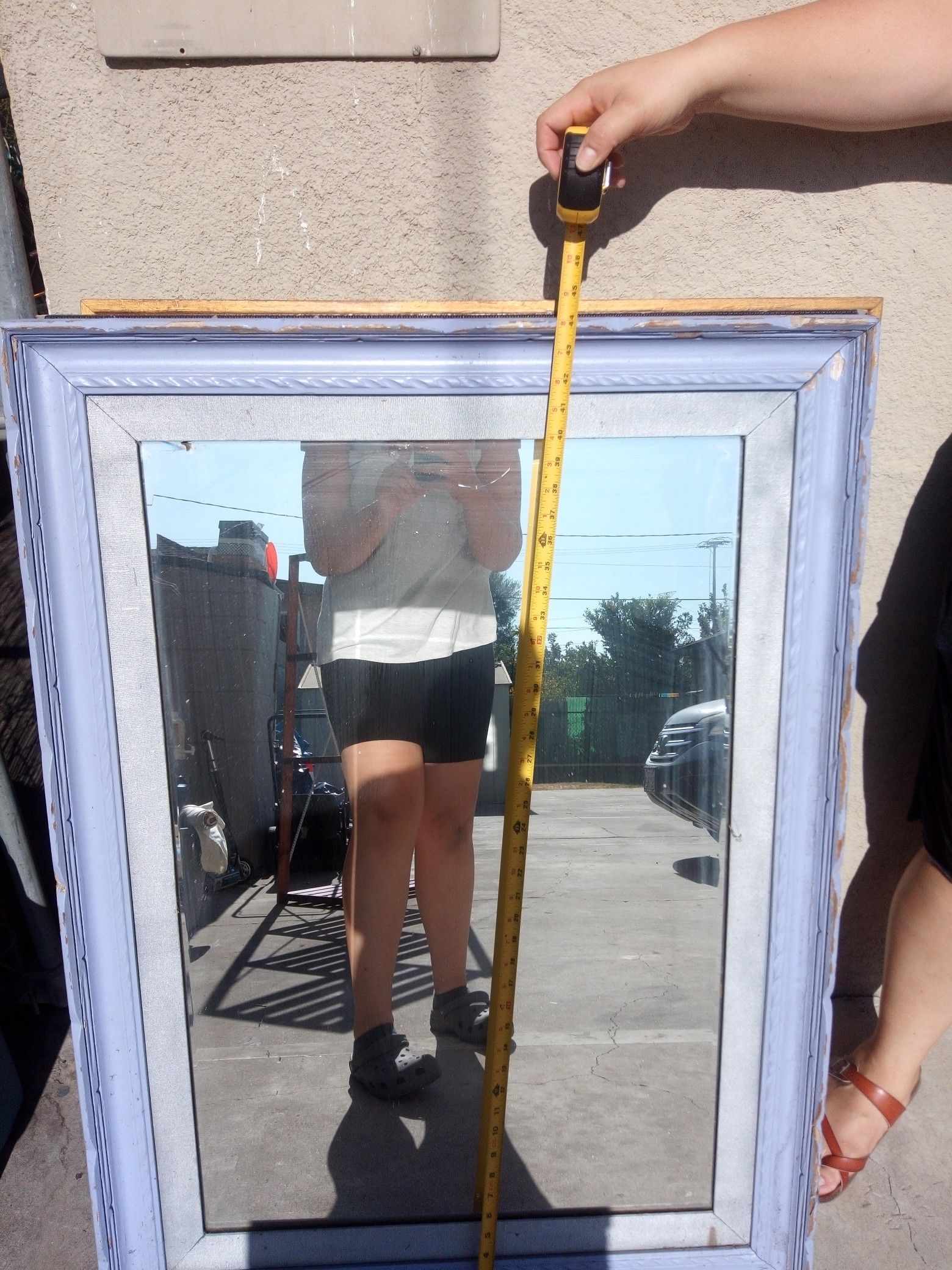 44" x 32" mirror in wood frame.