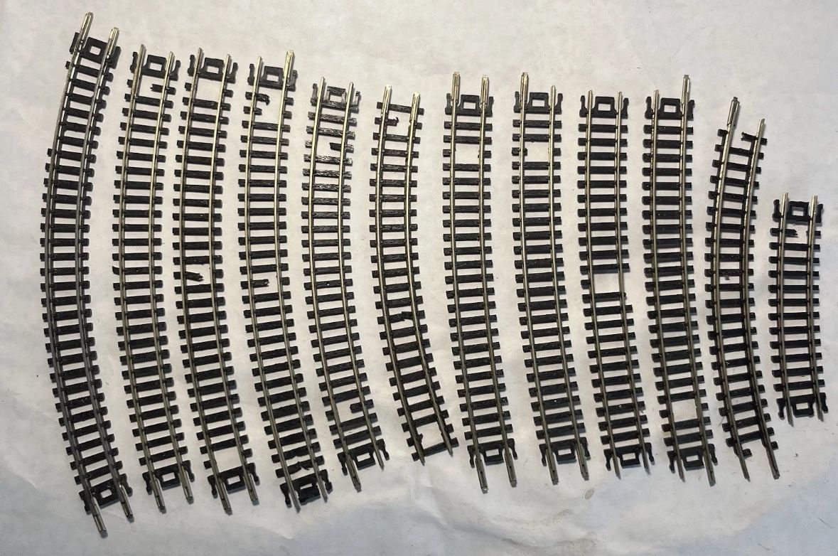 Set Of 12 N Scale Curved Model Railroad Tracks. Some Missing Rail Ties.