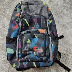 Dakine Jewel 26L backpack in a multi-color geometric pattern