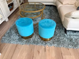 2 teal velvet ottomans