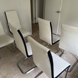 6 White modern Chairs (60 Or 10 Per Chair) 