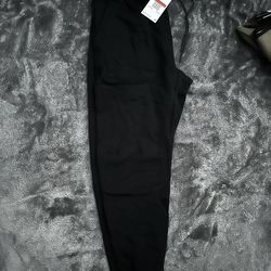Black Nike tech pants