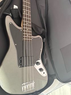 Base guitar , with case , the cord that connects to the amp and a