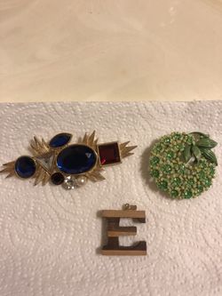 Brooches and E pendant.