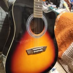 Mint washburn acoustic electric guitar set up professionally to play very easily 
Sounds great