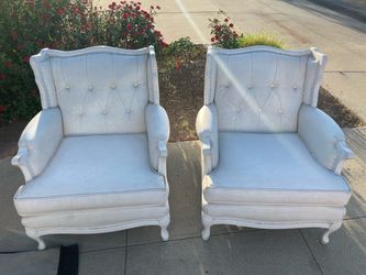 Two white leather chairs