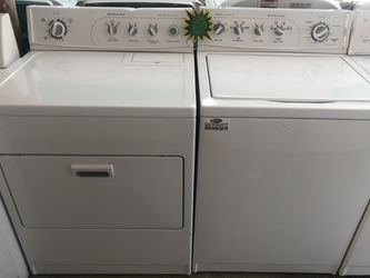 A white Kitchen Aide set of washer and dryer