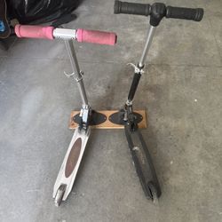 2 Scooters W/stands