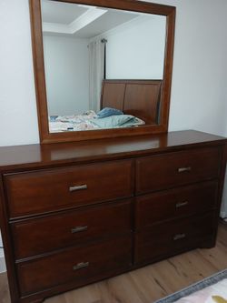 Wooden dresser with mirror