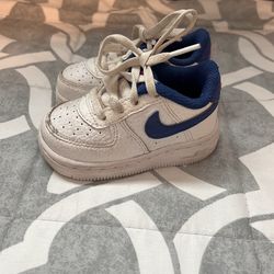 White And blue Air Force 1s