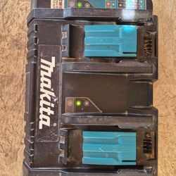 Makita dual charger and 1.  5 amp battery