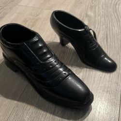 Black solid metal his and hers decorative shoes 