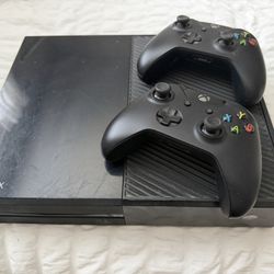 Xbox And Two Controllers 