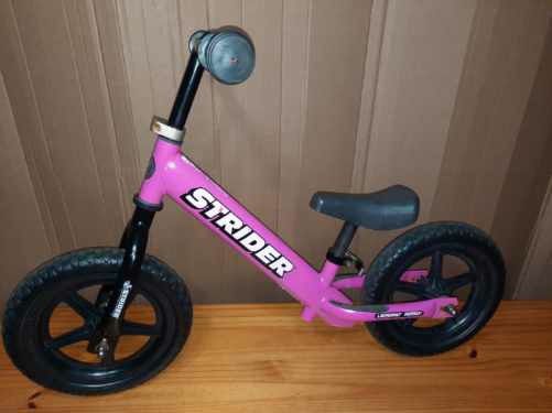 Pink strider balance bike