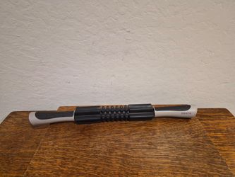 Centr by Chris Hemsworth Massage Roller Stick with Black and Sand Textured Handles and Rolling Nodules.
21"