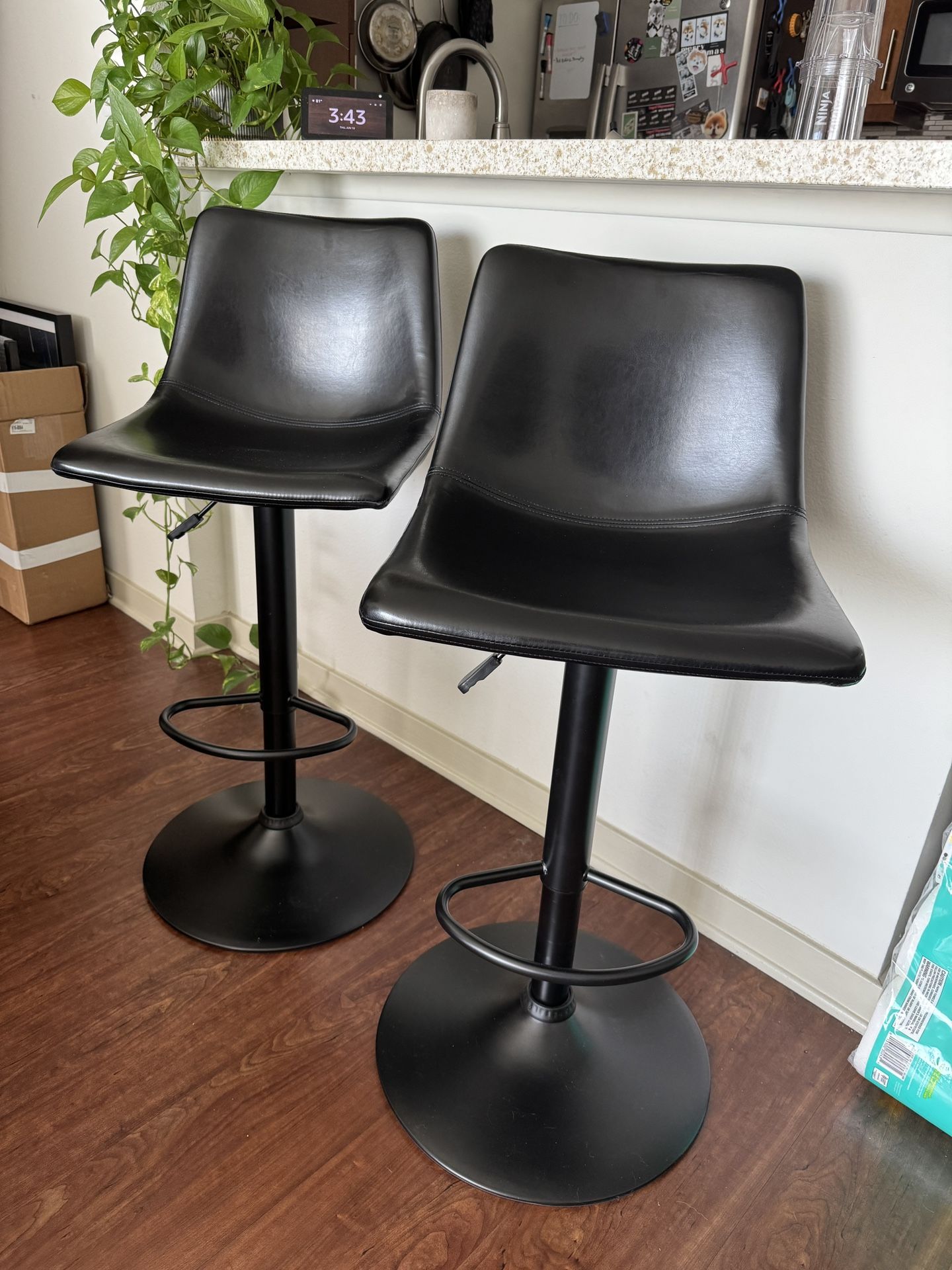 Pair of Black Leather Adjustable Bar Stools